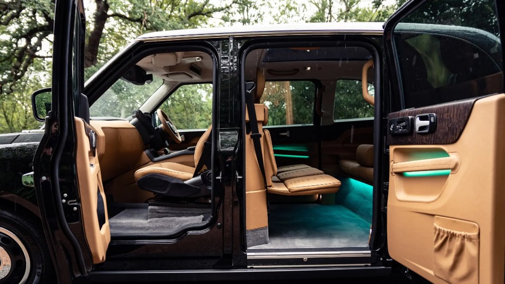 Tan leather interior of a modern taxi with the doors open
