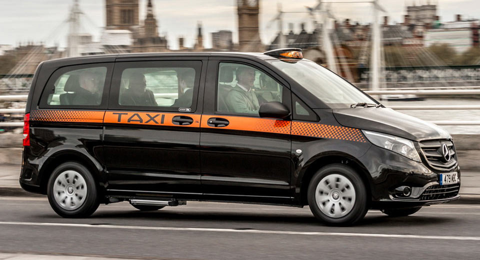 Black Mercedes Vito taxi on the road